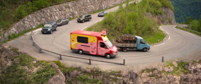 Cupcake truck being chased down alpine road in Germany.