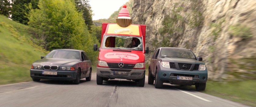 Cupcake truck being chased down alpine road in Germany.