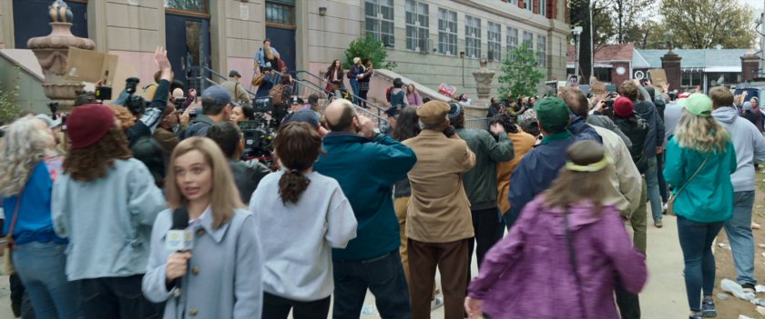 Students and reporters gather in front of Midtown High.