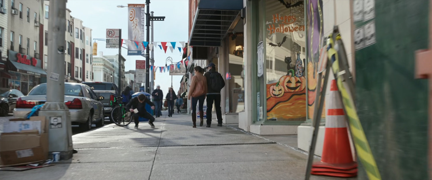 Crowd on sidewalk outside the Peter Pan bakery.
