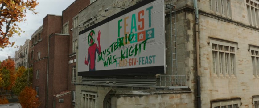 Graffiti'd FEAST billboard outside Queens shelter.