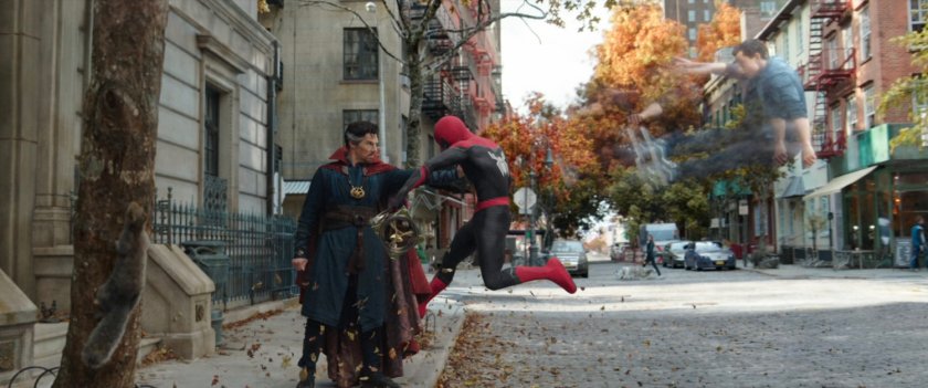 Doctor Strange pushing Spider-Man's astral projection out of his body in front of the Sanctum Sanctorum.