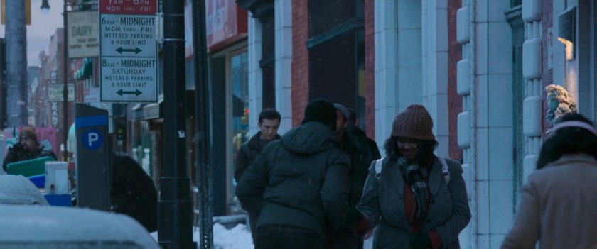 Peter on snowy sidewalk outside the Peter Pan bakery.