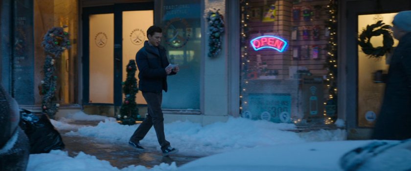 Peter on snowy sidewalk outside the Peter Pan bakery.