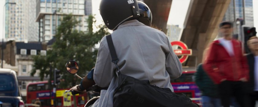 Layla and Steven on moped on London street.