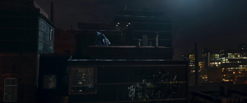 Moon Knight running across a dark London rooftop.