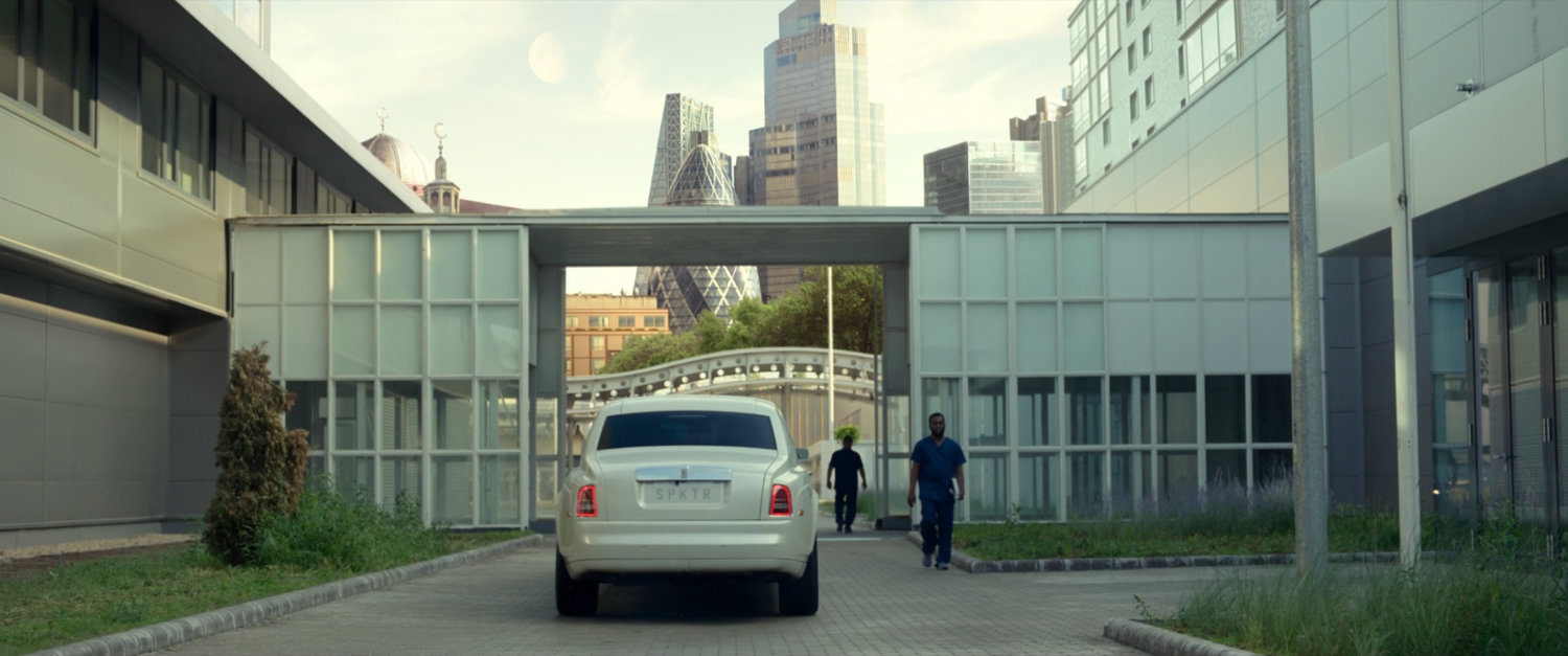 A white Limo outside the Sienkiewicz Psychiatric hospital with London skyline in the background.