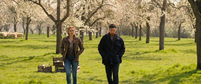 Stephen Strange and Wanda Maximoff in an apple orchard.