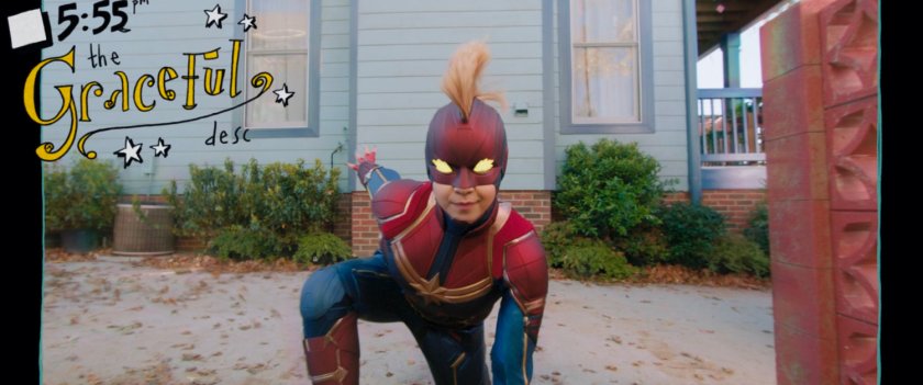 Kamala strikes a superhero pose outside the Khan house.