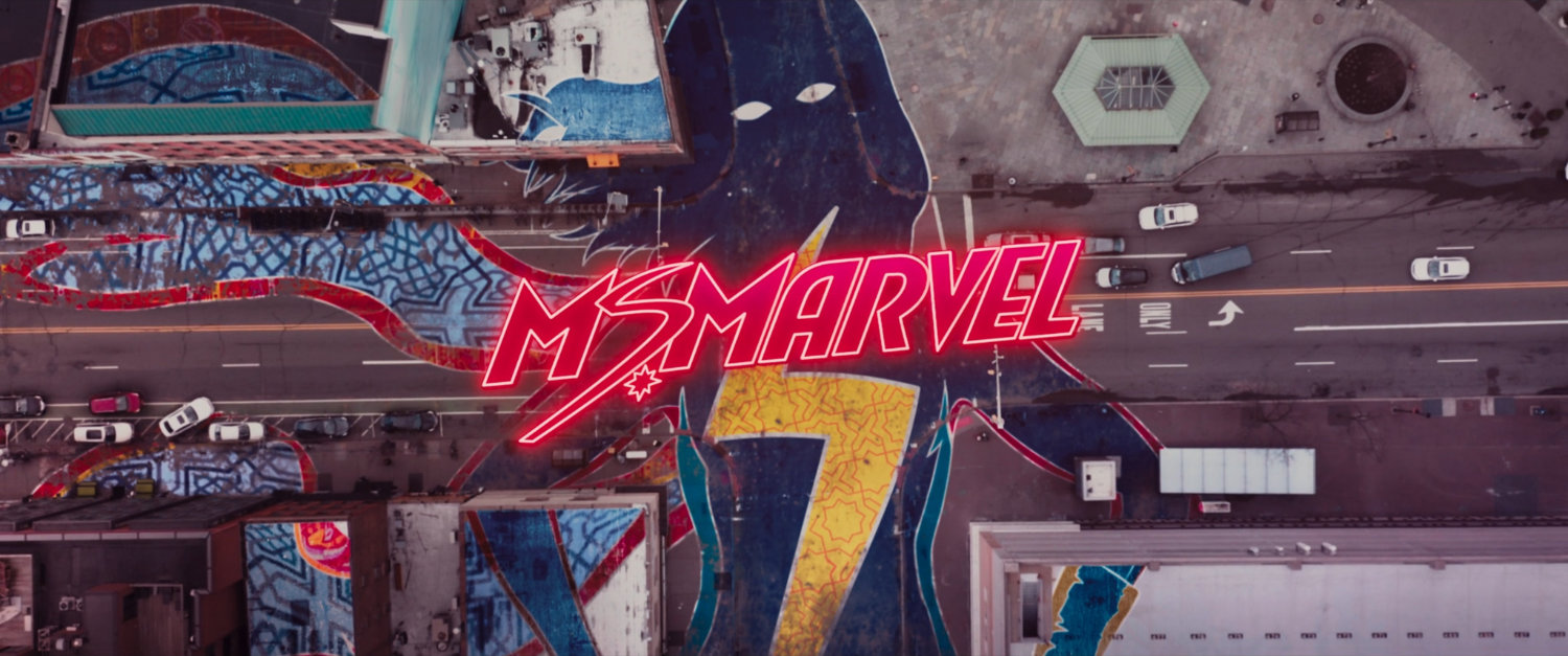 Ms Marvel end credit screen: Aerial Intersection (Text: Ms Marvel Title Card)