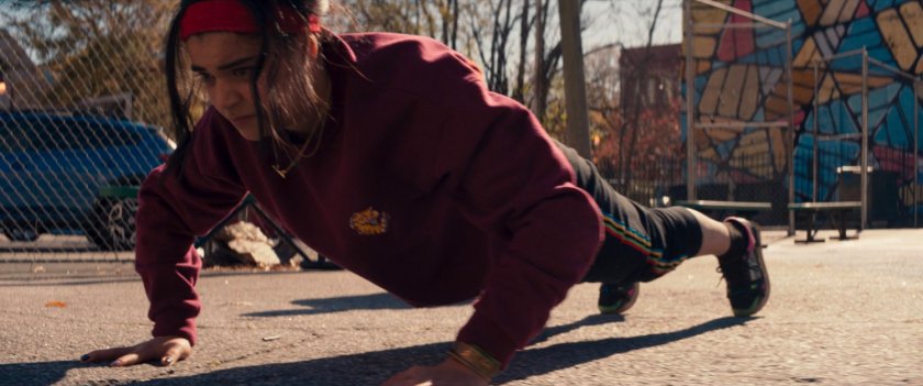 Kamala doing pushups on a playground.