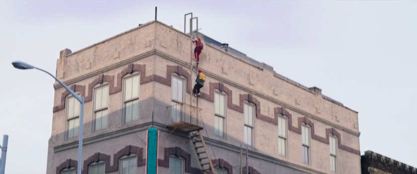 Bruno and Kamala climb ladder onto the rooftop of Circle Q.