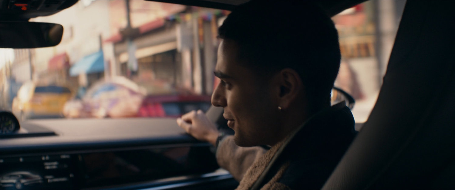 Kamran in car in shopping district.