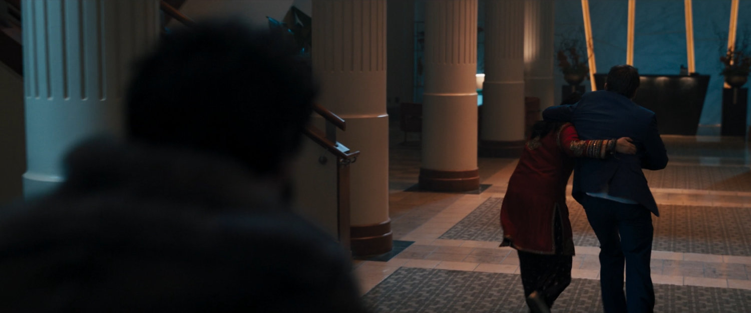 Kamala and Kamran in lobby of wedding reception venue.