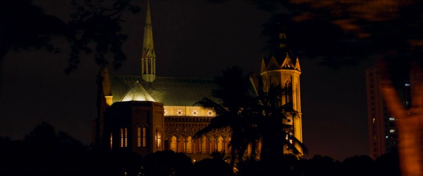 Nighttime view of Karachi featuring church-like building.