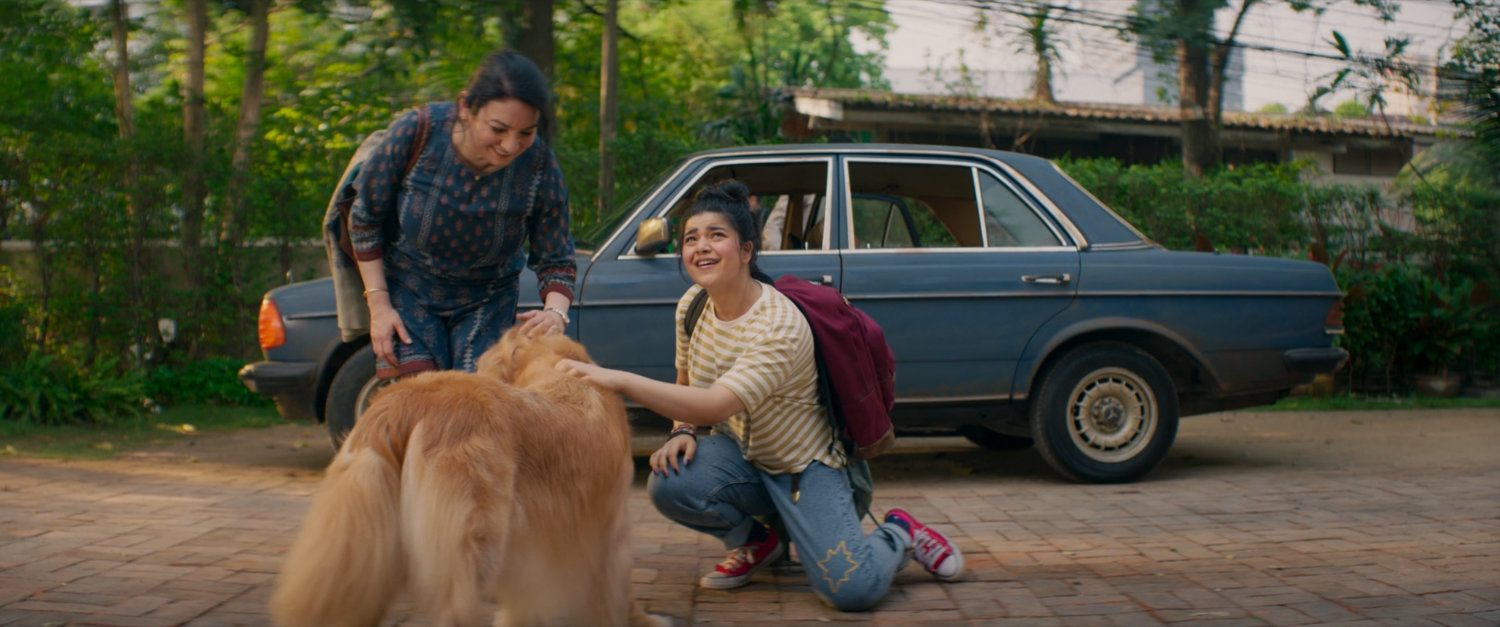 Kamala and Muneeba outside Sana's house.
