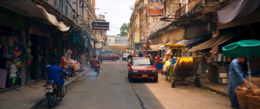 A crowded Karachi marketplace street.