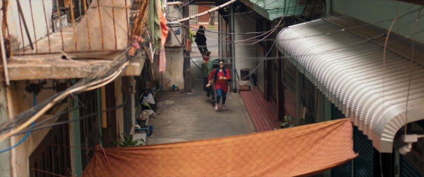 Kamala enters a Karachi alleyway.