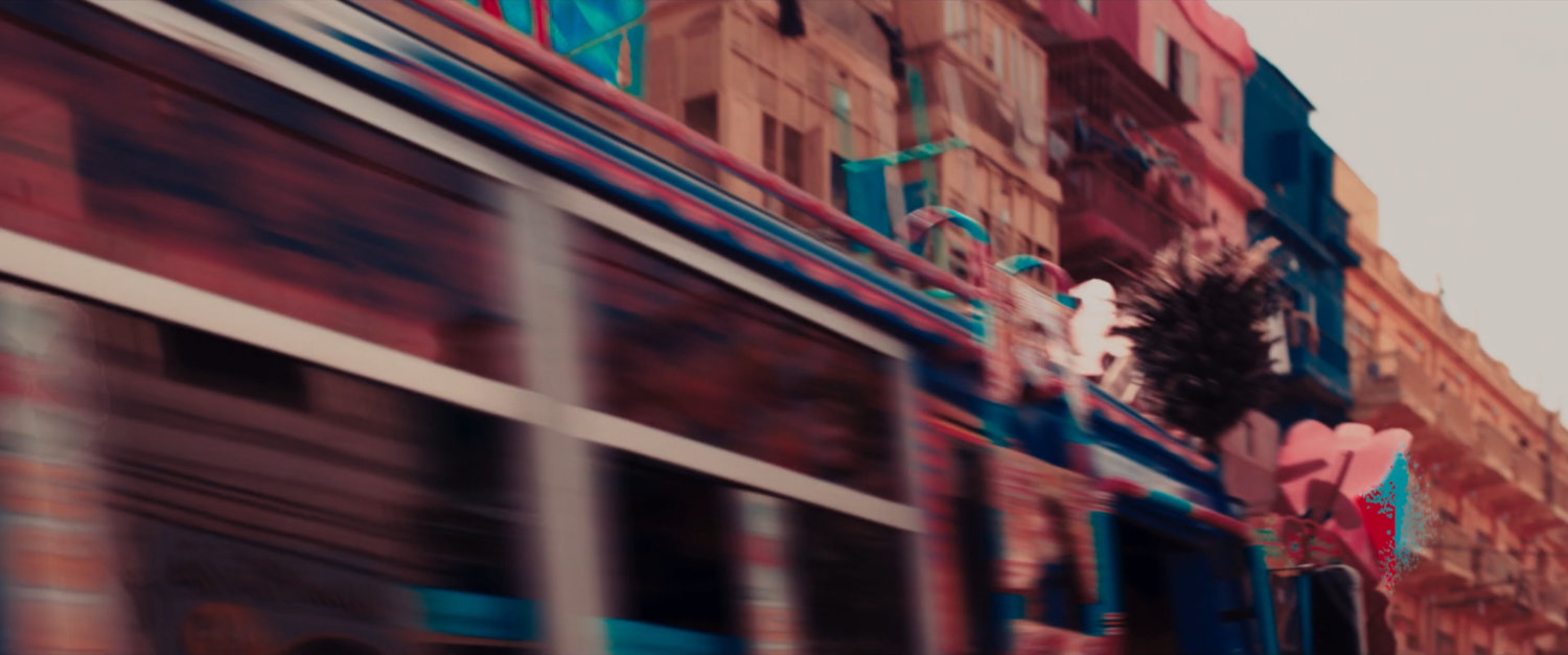 Ms Marvel end credit screen: Bus passing building with Balconies