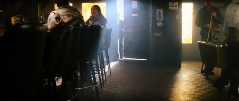 Interior of bar with door opening.