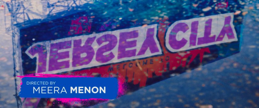 Ms Marvel end credit screen: Welcome to Jersey City Billboard reflection (Text: Directed by Meera Menon)