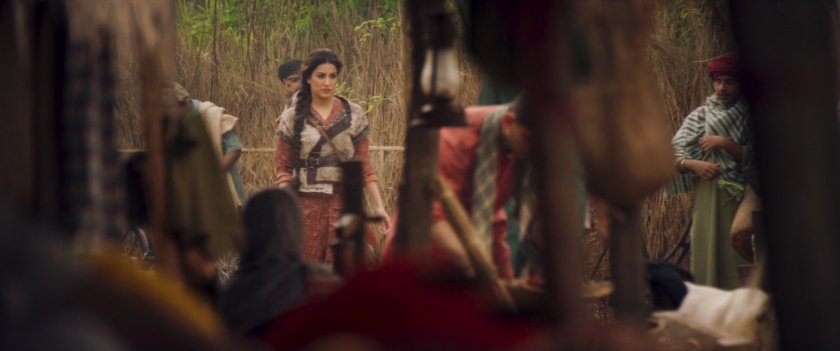 Aisha entering Indian village.