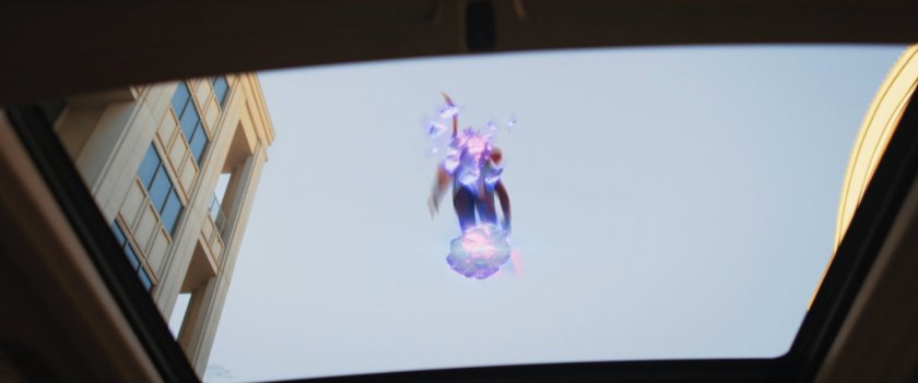 Ms Marvel runs past on platforms of hard light.