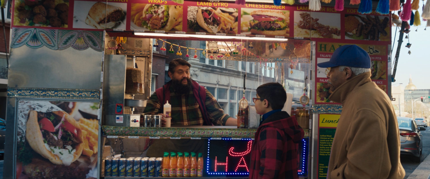 Najaf making gyros at his food truck.