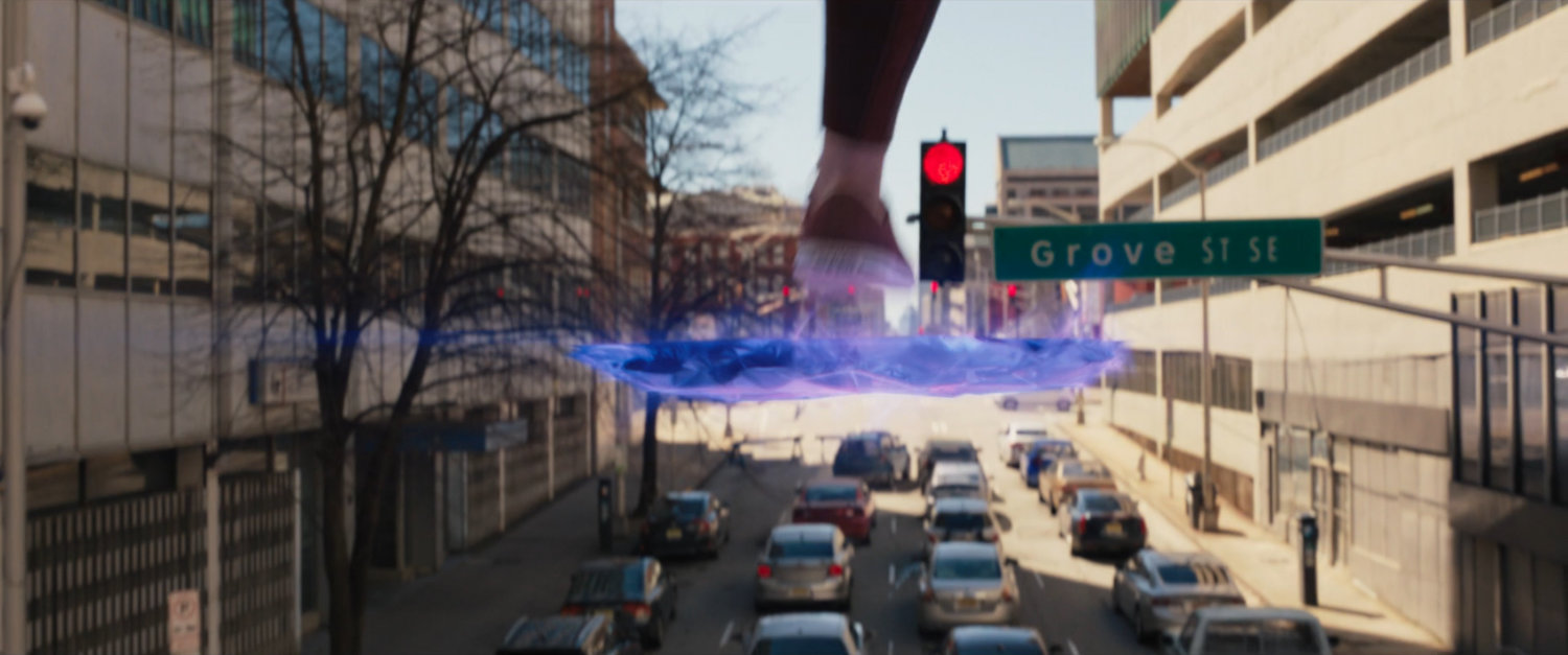 Ms Marvel runs through the city above the ground on platforms of hard light.