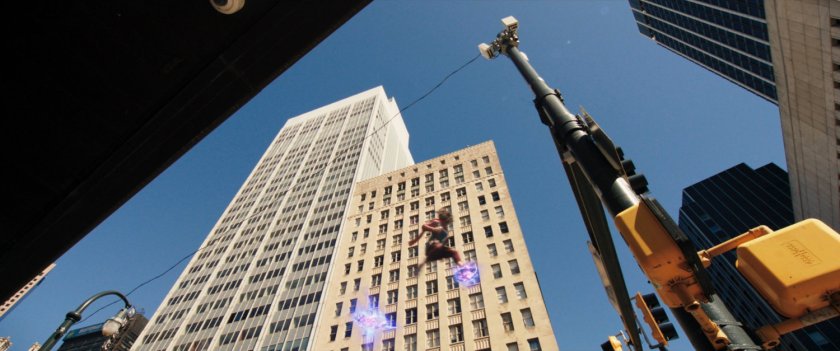 Ms Marvel runs through the city above the ground on platforms of hard light.