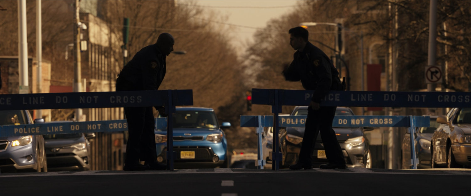 Police set up blockades at an intersection.