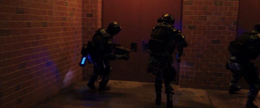DODC guards outside of Coles Academic High School.