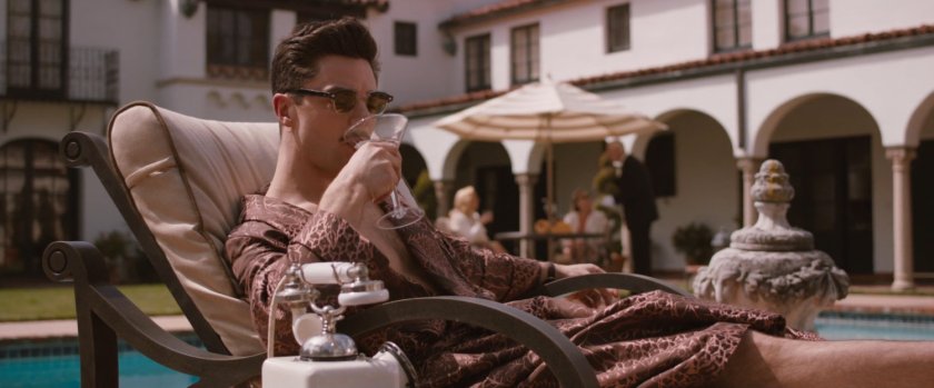 Howard Stark lounging outside his mansion.