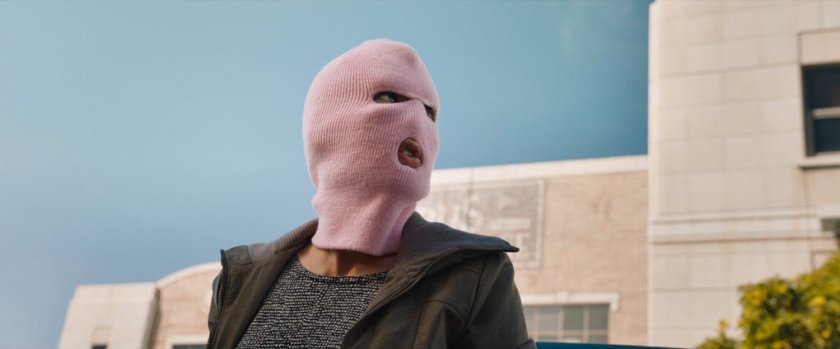 Claire with pink ski mask exiting car.