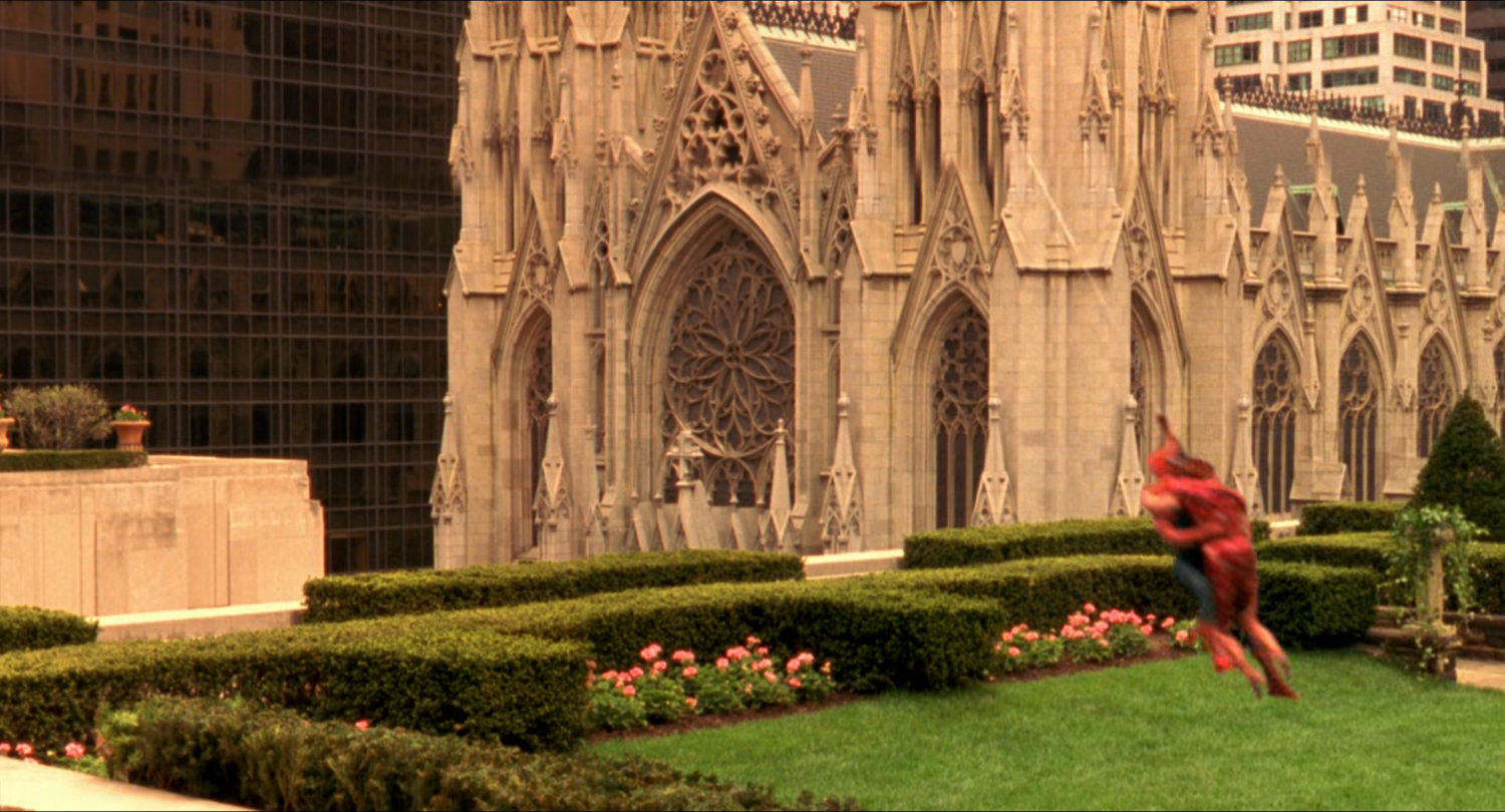 Spider-Man and Mary Jane on the Rockefeller rooftop gardens with St. Patrick's Cathedral.