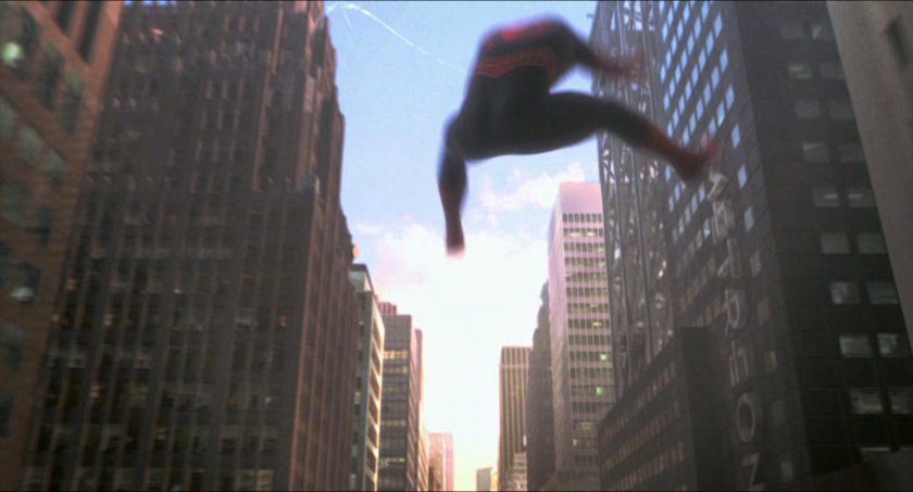 Spider-Man swinging between buildings in New York.