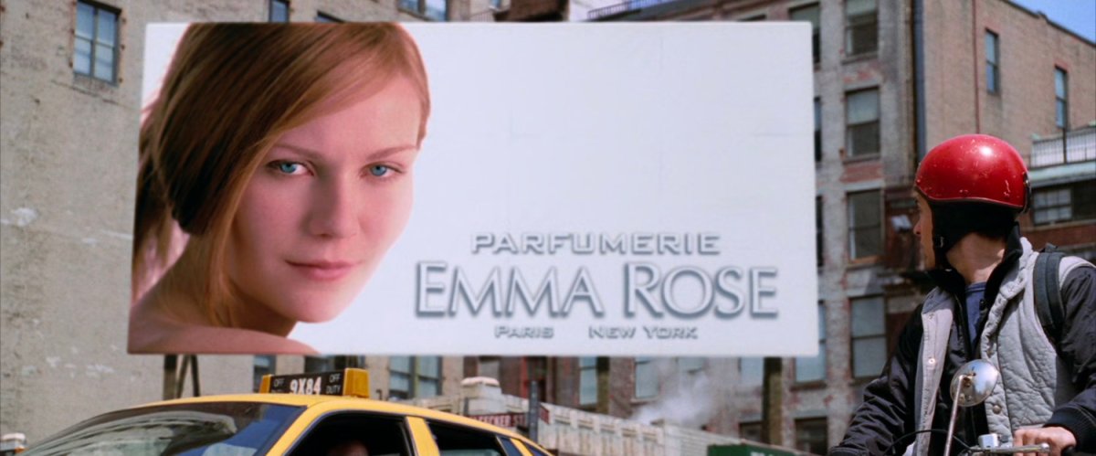 Peter Parker on moped sees billboard with Mary Jane.