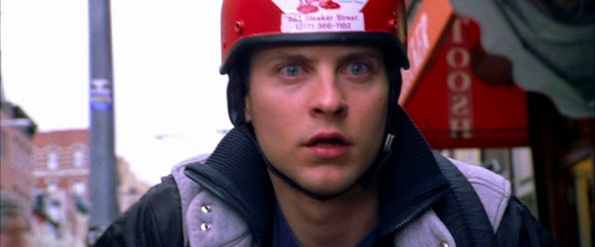 Peter Parker in front of Joe's Pizza.