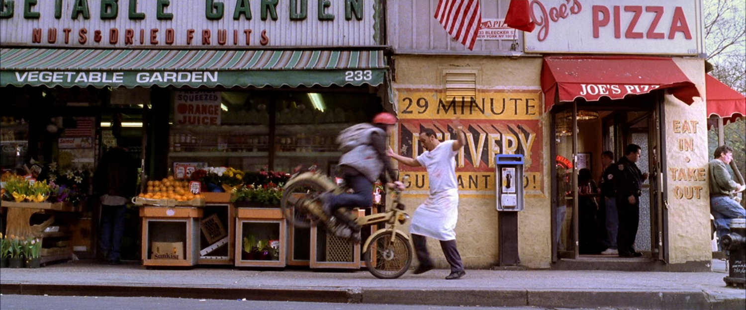 Peter Parker in front of Joe's Pizza.