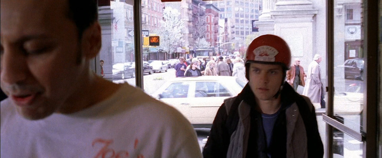 Peter Parker in front of Joe's Pizza.