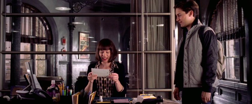 Peter Parker and Betty Brant inside Daily Bugle offices.