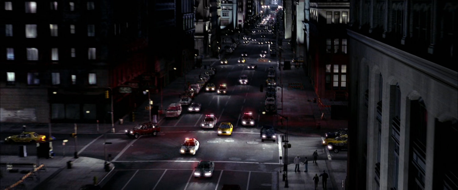 Police chase on New York street at night.