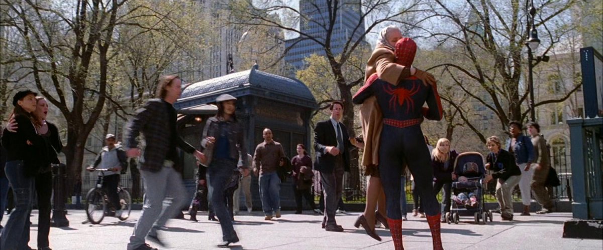 Spider-Man with Aunt May in park.