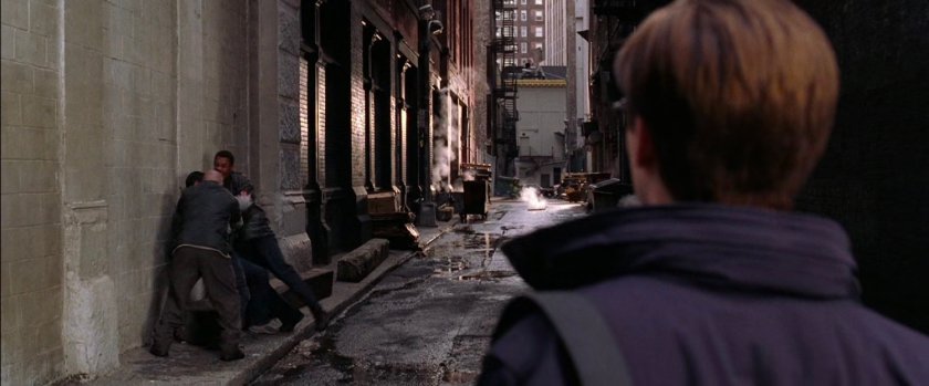Peter Parker witnessing mugging in alley.