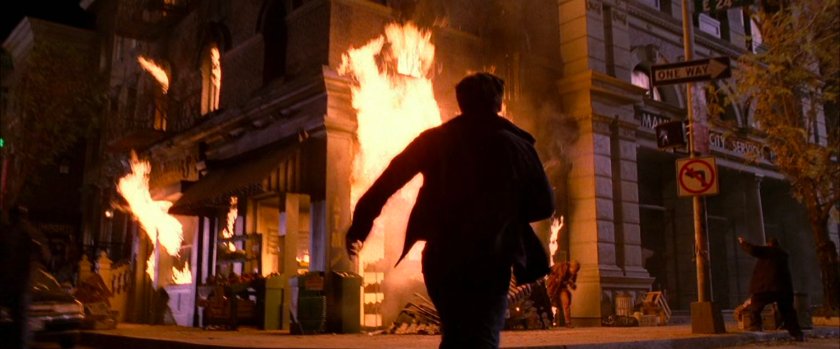 Peter Parker runs into burning apartment building.