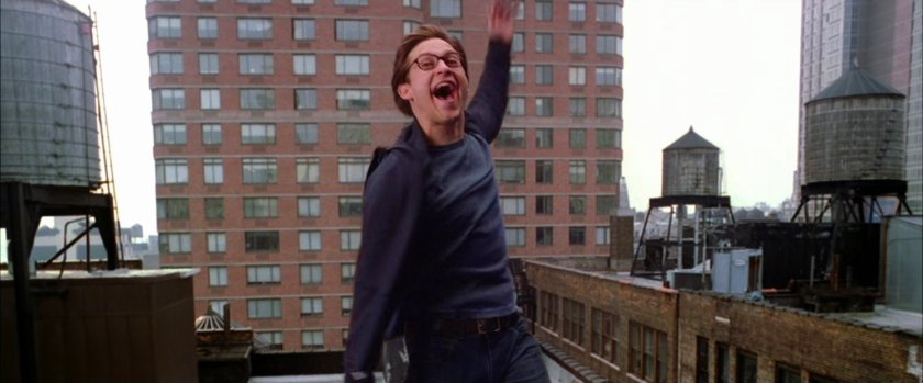 Peter Parker leaping from rooftop.