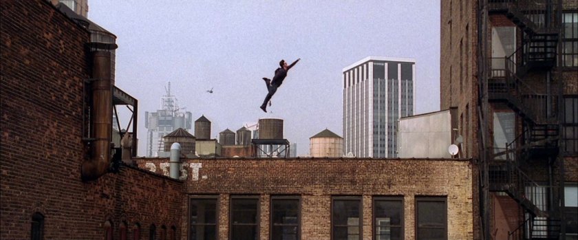 Peter Parker leaping from rooftop.