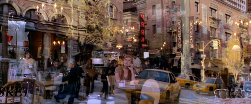 Mary Jane sitting in cafe.