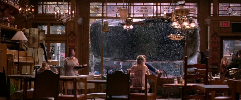 Car crashes through cafe window.