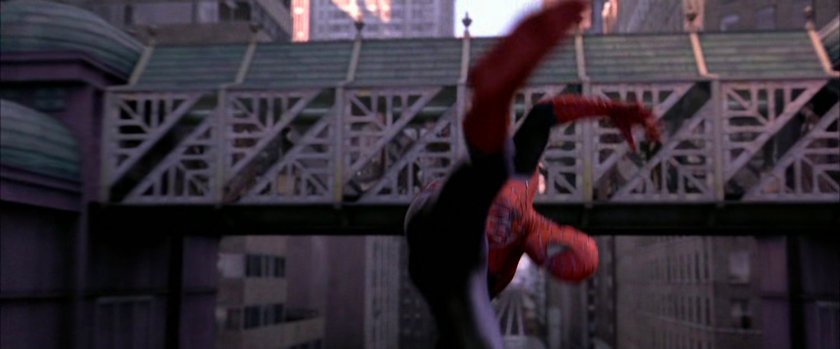 Spider-Man diving under bridge on speeding train.